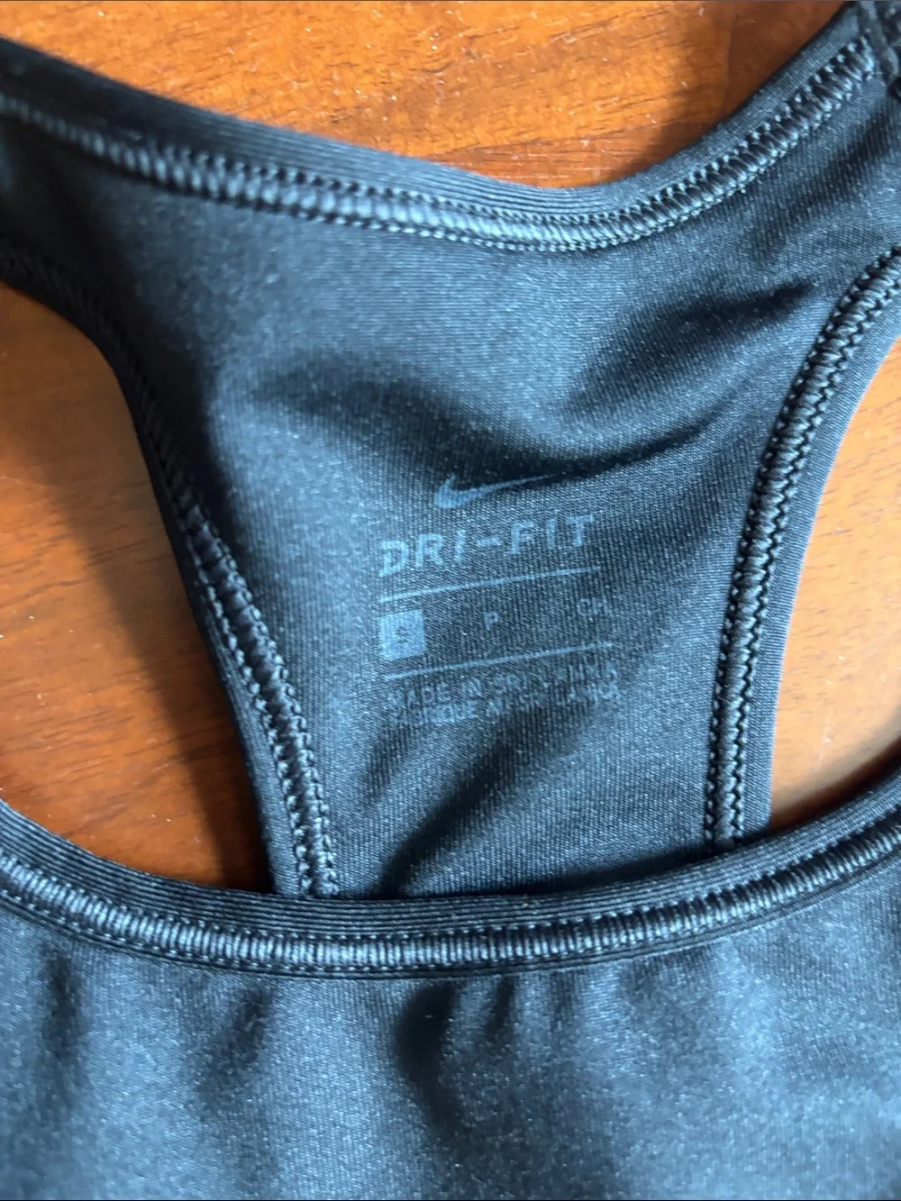 2 Nike and 1 pink Victoria’s Secret Gray Dri-FIT Racerback Sports Bra